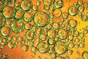 Abstract orange colorful background with oil on water surface. Oil drops in water abstract psychedelic, abstract image. photo
