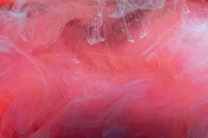 clouds of red and blue smoke on black background, clouds of paint in water, aquarium, abstract background, texture photo