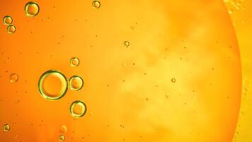 Abstract orange colorful background with oil on water surface. Oil drops in water abstract psychedelic, abstract image. photo
