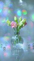 Beautiful pink and green flowers in a vase on a table photo