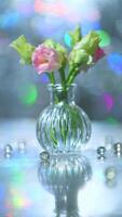 Beautiful pink and green flowers in a vase on a table photo