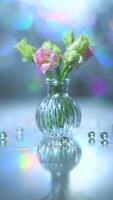 Beautiful pink and green flowers in a vase on a table photo