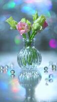 Beautiful pink and green flowers in a vase on a table photo
