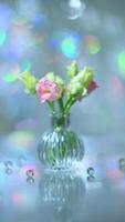 Beautiful pink and green flowers in a vase on a table photo