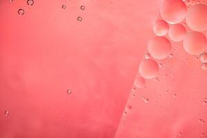 Abstract pink colorful background with oil on water surface. Oil drops in water abstract psychedelic, abstract image. photo