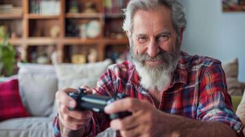 Mature man with playful smile enjoying computer gaming at home with console controller photo