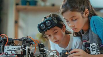 Concentrated young girls building and programming robot, one wearing head-mounted magnifying glasses photo