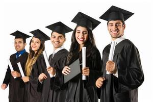 Young Brazilian college graduates holding their diplomas with graduation cap while standing in a row and smiling photo