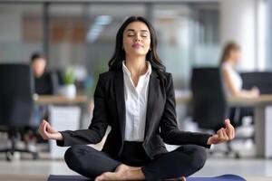 Brazilian businesswoman practicing yoga at workplace photo