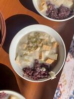 bowls of food on a table with a bowl of soup and a bowl of rice photo
