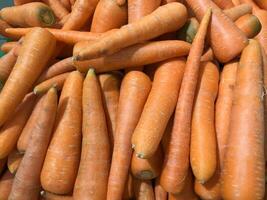 there are many carrots that are piled together in a pile photo