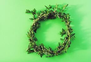 Wreath of wildflowers on soft light colorful background. photo