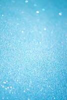 Glitter paper background. Festive sparkle texture. Decorative element for party, birthday, New Year design photo