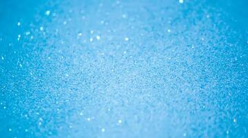 Glitter paper background. Festive sparkle texture. Decorative element for party, birthday, New Year design photo