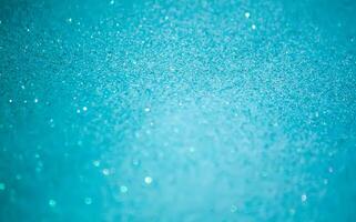 Glitter paper background. Festive sparkle texture. Decorative element for party, birthday, New Year design photo