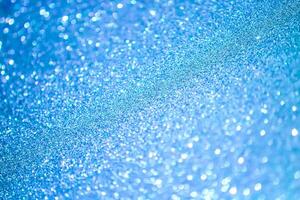 Glitter paper background. Festive sparkle texture. Decorative element for party, birthday, New Year design photo