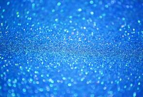 Wrapping paper background with colorful glitter texture. Christmas, New Year festive decoration. Sparkling bright surface photo