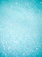 Glitter paper background. Festive sparkle texture. Decorative element for party, birthday, New Year design photo