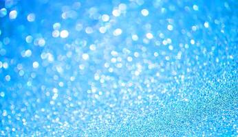 Glitter paper background. Festive sparkle texture. Decorative element for party, birthday, New Year design photo