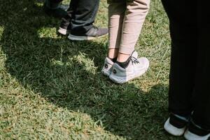 Feet of participants poised for action, showcasing the readiness and enthusiasm at a team-building event photo