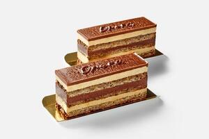 Opera cake slices with walnut sponge, chocolate ganache and buttercream photo