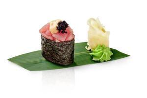 Tuna gunkan sushi with caviar and mayo on bamboo leaf photo