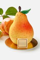 Artisan dessert in shape of pear on gold plate photo