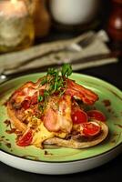 Bruschetta with veal steak, sauce, crispy onions and fried bacon photo