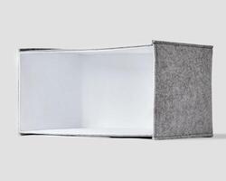 Handmade gray felt box with white interior lining and handles for storing things photo