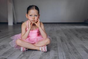 Baby ballet studio. Little ballerina with a coach in dance class. Ballet trainer for children photo