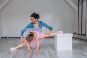 Baby ballet studio. Little ballerina with a coach in dance class. Ballet trainer for children photo