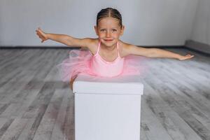 Baby ballet studio. Little ballerina with a coach in dance class. Ballet trainer for children photo