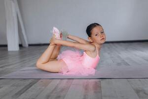 Baby ballet studio. Little ballerina with a coach in dance class. Ballet trainer for children photo