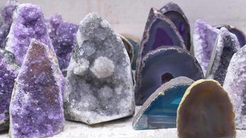Various rocks are showcased on a table for art display video