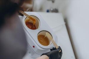 Sugar paste for shugaring depilation. Beauty spa minimalist concept. photo