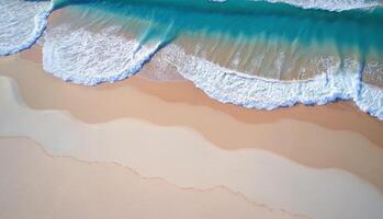 A beach scene with a body of water, likely the ocean. The shoreline is covered in sand, and the waves are crashing onto the beach. photo