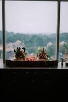 Exquisite floral centerpiece adorning a hotel table, adding a touch of elegance and freshness to the ambiance photo