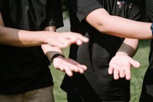 Hands poised to clap, capturing the energy and unity of a team-building event in action photo