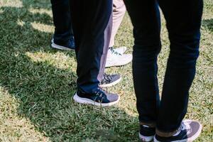 Feet of participants poised for action, showcasing the readiness and enthusiasm at a team-building event photo