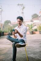 A person with a baffled expression, looking at something confusing on their phone photo