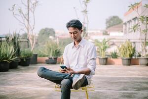 A person with a baffled expression, looking at something confusing on their phone photo