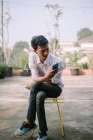 Man displaying strange content on his smartphone, looking perplexed. photo