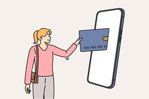 Woman mobile banking user inserts credit card into large phone to make purchase in online store vector