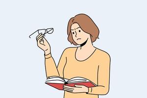 Woman experiences vision problems reading book and looks at glasses with upset grimace vector