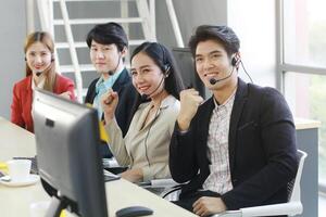 Powerful and Sucessful of Business group Call Center and technical Support staff for receptionist phone operator. Asian customer support team. photo