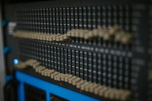An audio mixer with its knobs and sliders meticulously adjusted, embodying precision and control in the art of sound engineering and music production photo