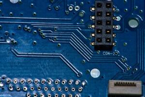 a close up of a circuit board with gold and silver circles photo