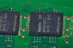 a close up of a green electronic circuit board photo