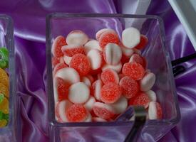 a table with a bunch of different types of candy photo
