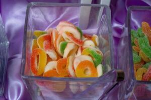 a table with several different types of candy photo